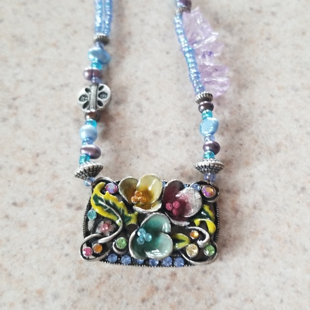 Irridescent blue beaded necklace with pendant